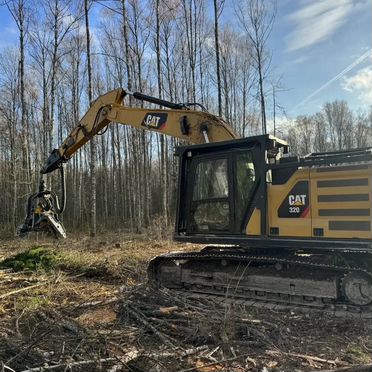 Гусеничный харвестер Caterpillar 320